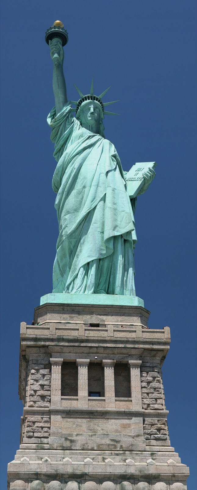 Full frontal view of the Statue of Liberty from the base to the torch